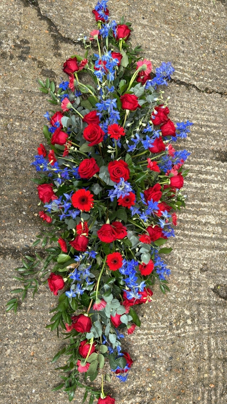 blue and red cofin spray for Crystal Palace fan from Blooms and Candy Florist in Hayes for free delivery in Bromley, Croydon, Croydon Crematorium, Heither Crematorium, Beckenham Crematorium, Lewisham Crematorium