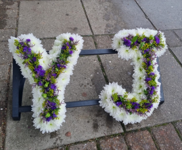 Inner flowers line funeral letters made by funeral florist from Bromley