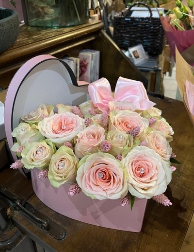 pink heart shaped hatbox filled with fresh roses. Lovely longlasting gift made by luxury florist from Hayes in Bromley