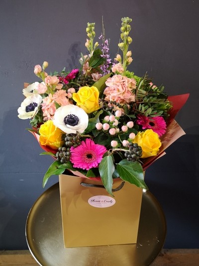 Stunning bright bouquet to include anemones, Genista, berries handmade by florist in Bromley, Kent, lovely gift for Mothering Sunday 19th of March 2023