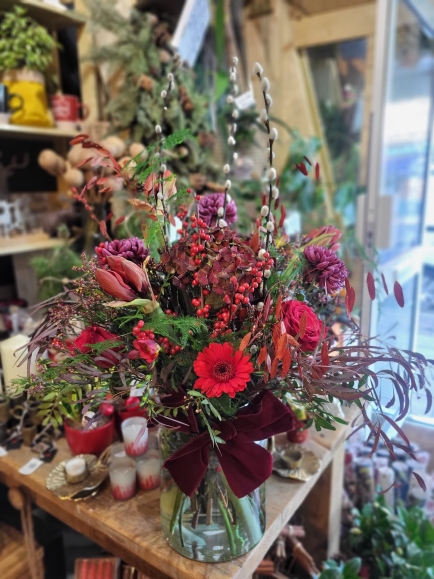 Perfect showstopper Christmas Vase with fresh flowers and winter foliages by florist Blooms and Candy in Hayes