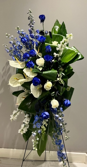 Contemporary standing service spray for funeral ceremony made by florist in Hayes, Bromley 