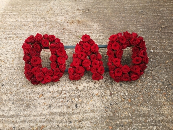 luxury look of letters made only from roses made by funeral Bromley Florist