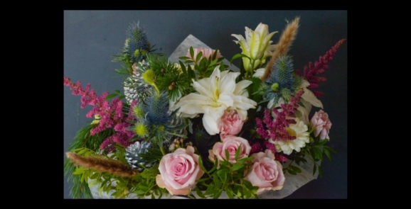 Fun & Frosty Hand-tied Bouquet to include white lily, pink roses, thistle, eucalyptus, astilbe, daisies, grasses, cones handmade by florist in Hayes, Bromley, UK.