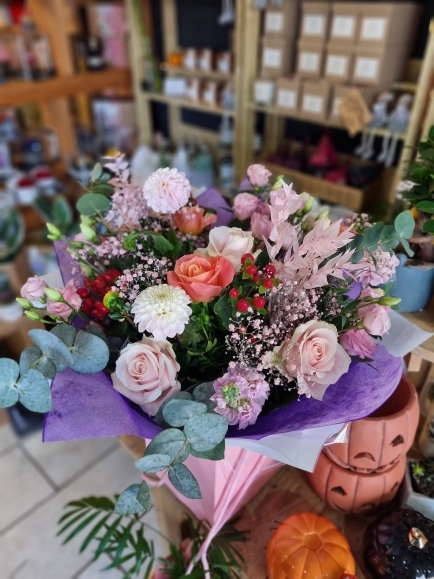 Stunning romantic bouquet to include soft pinks and autumnal foliages with berries. Made by florist in Bromley 