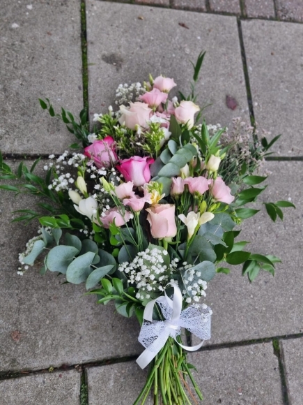 Soft pinks funeral sheaf perfect for burial made by florist from  Bromley